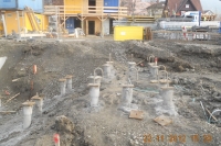 Heads of grouted driven cast iron piles 