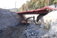 Road underpass, rock excavation below auxiliary bridge